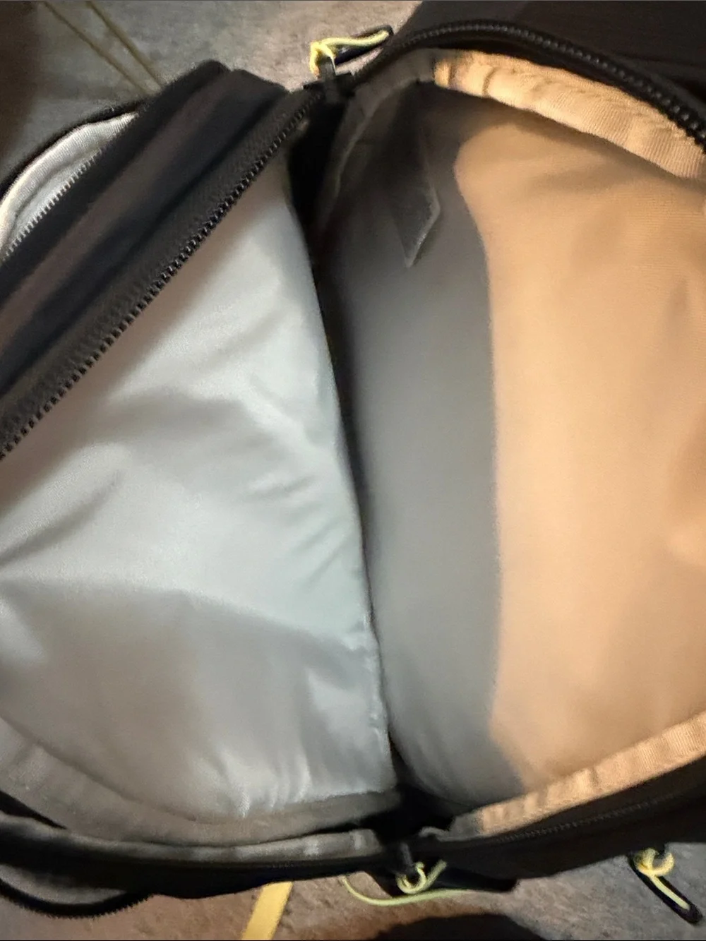 The North Face Black Backpack with Yellow Bungee and Straps